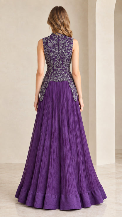 Back view of woman wearing purple sleeveless embroidered formal gown