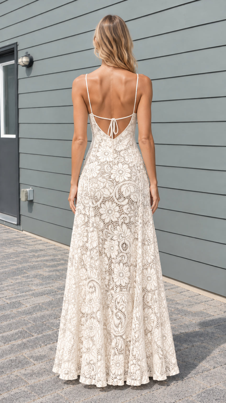 Model wearing cream floral lace maxi dress showing open tie back