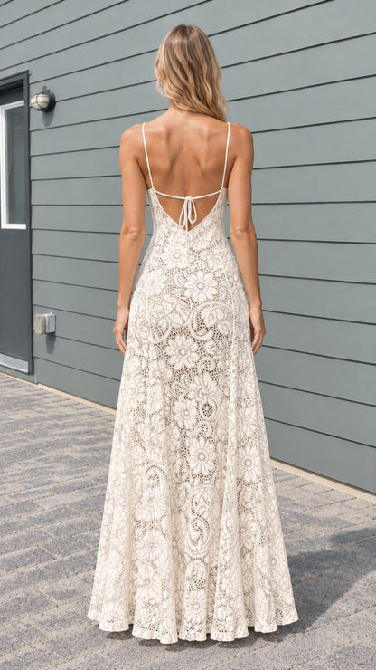 Model wearing cream floral lace maxi dress showing open tie back