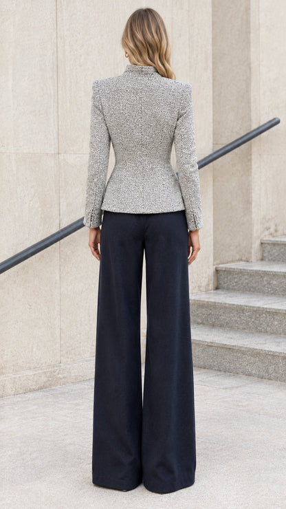 Back view of light grey fitted tweed jacket highlighting sculpted waist