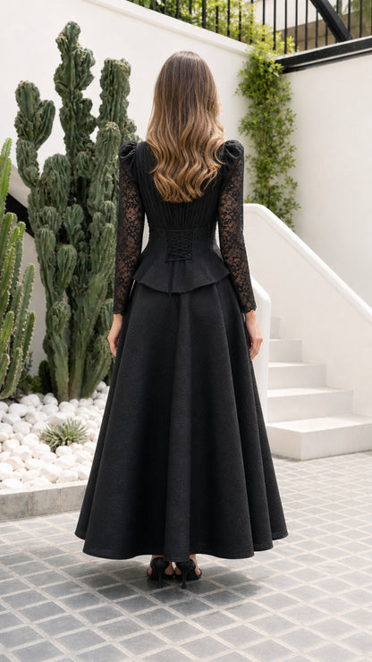 Back view of black formal maxi dress showing corset lace-up tie detail
