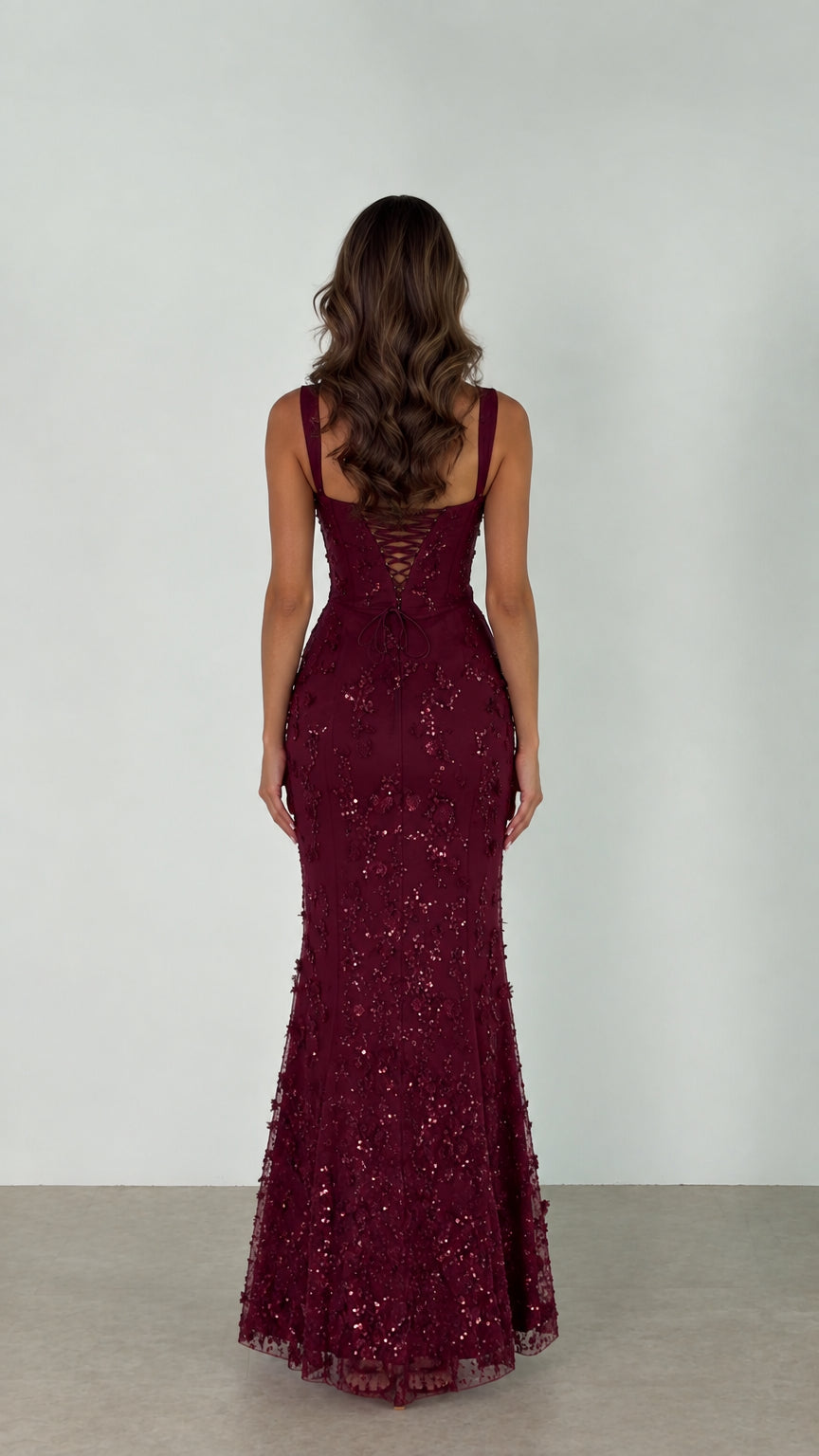 Back view of the Burgundy evening gown showcasing the lace-up corset back