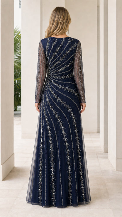 Back view of navy blue beaded long sleeve evening gown