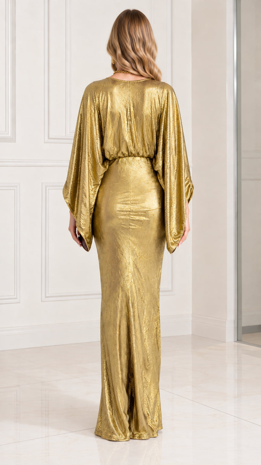 Back view of model wearing gold shimmering batwing formal maxi gown