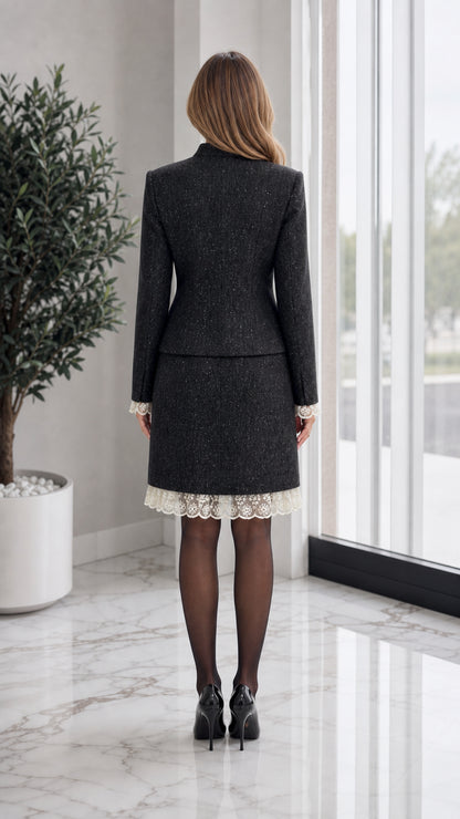 Back view of model in black tweed jacket and pencil skirt suit