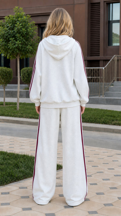 Back view of woman wearing white two-piece hooded lounge set
