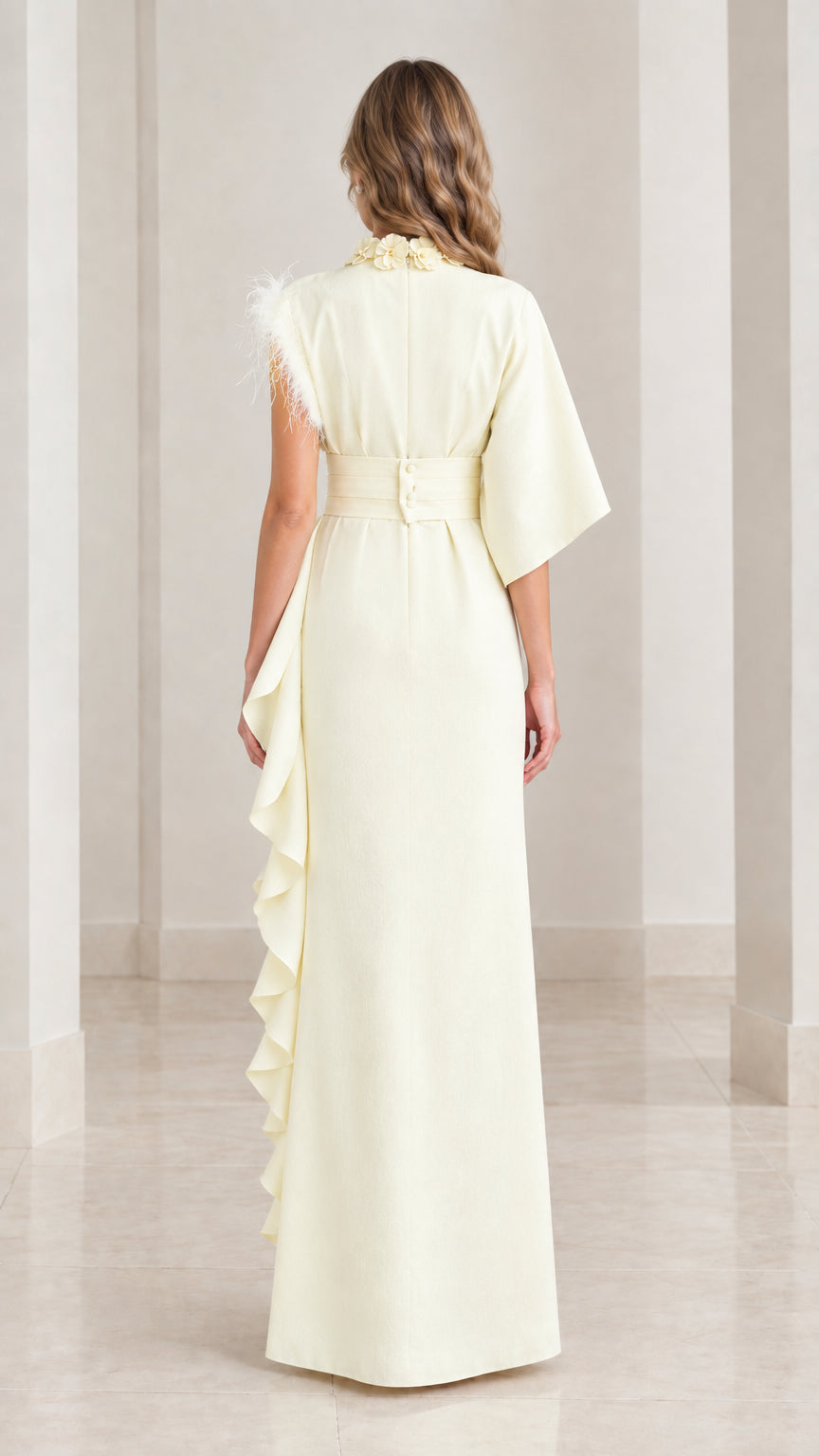 Back view of butter yellow maxi dress showing wide waistband and button closure