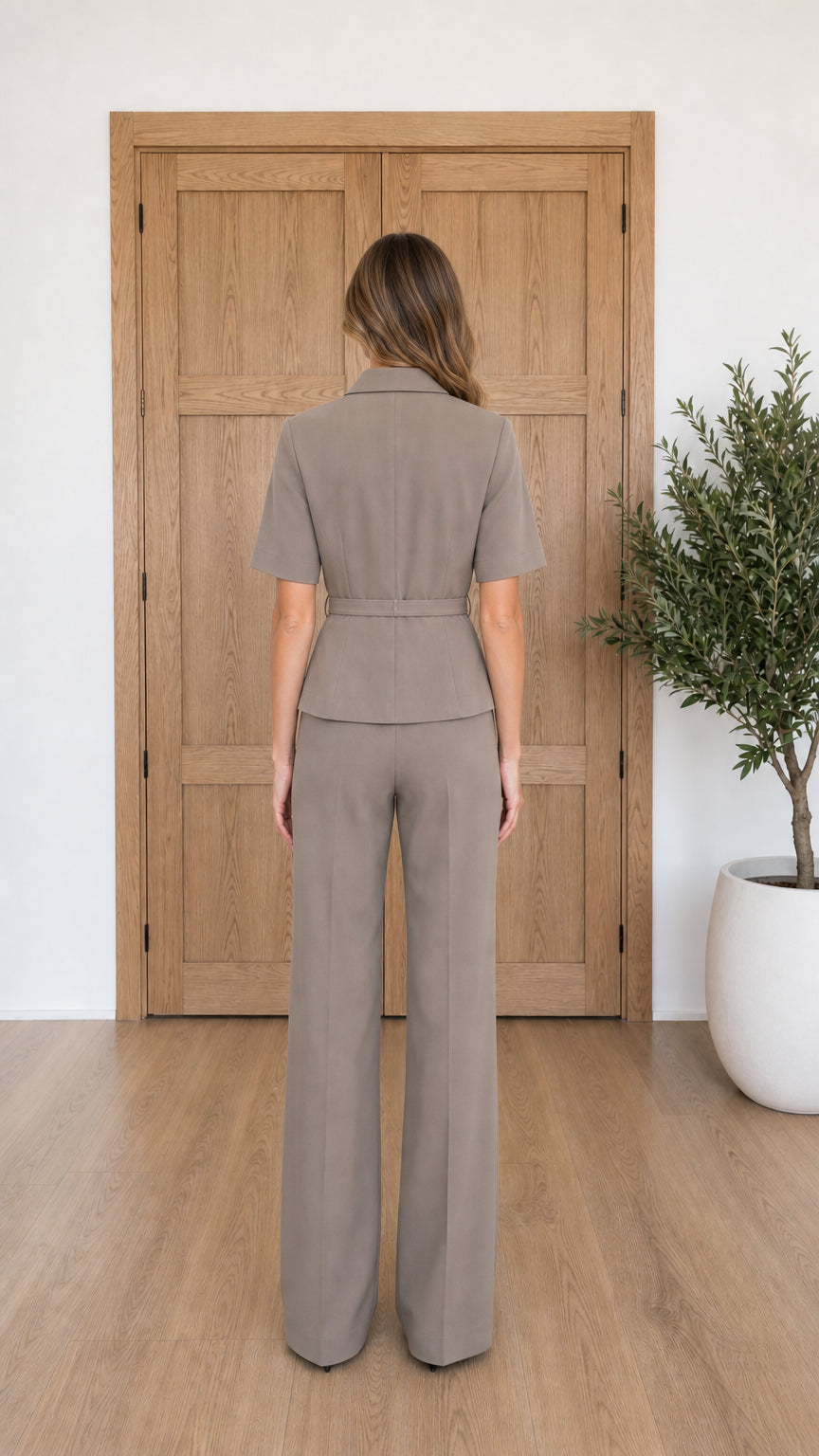 Taupe wide-leg jumpsuit shown from the back
