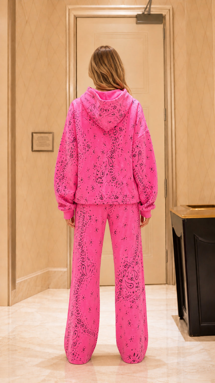 Back view of woman wearing Hot Pink hooded sweatshirt and matching wide-leg pants