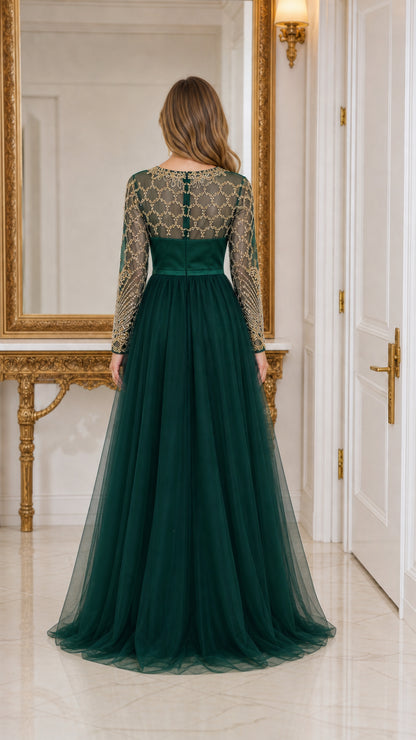 Back view of emerald green evening gown showing sheer embroidered back and floor-length tulle skirt