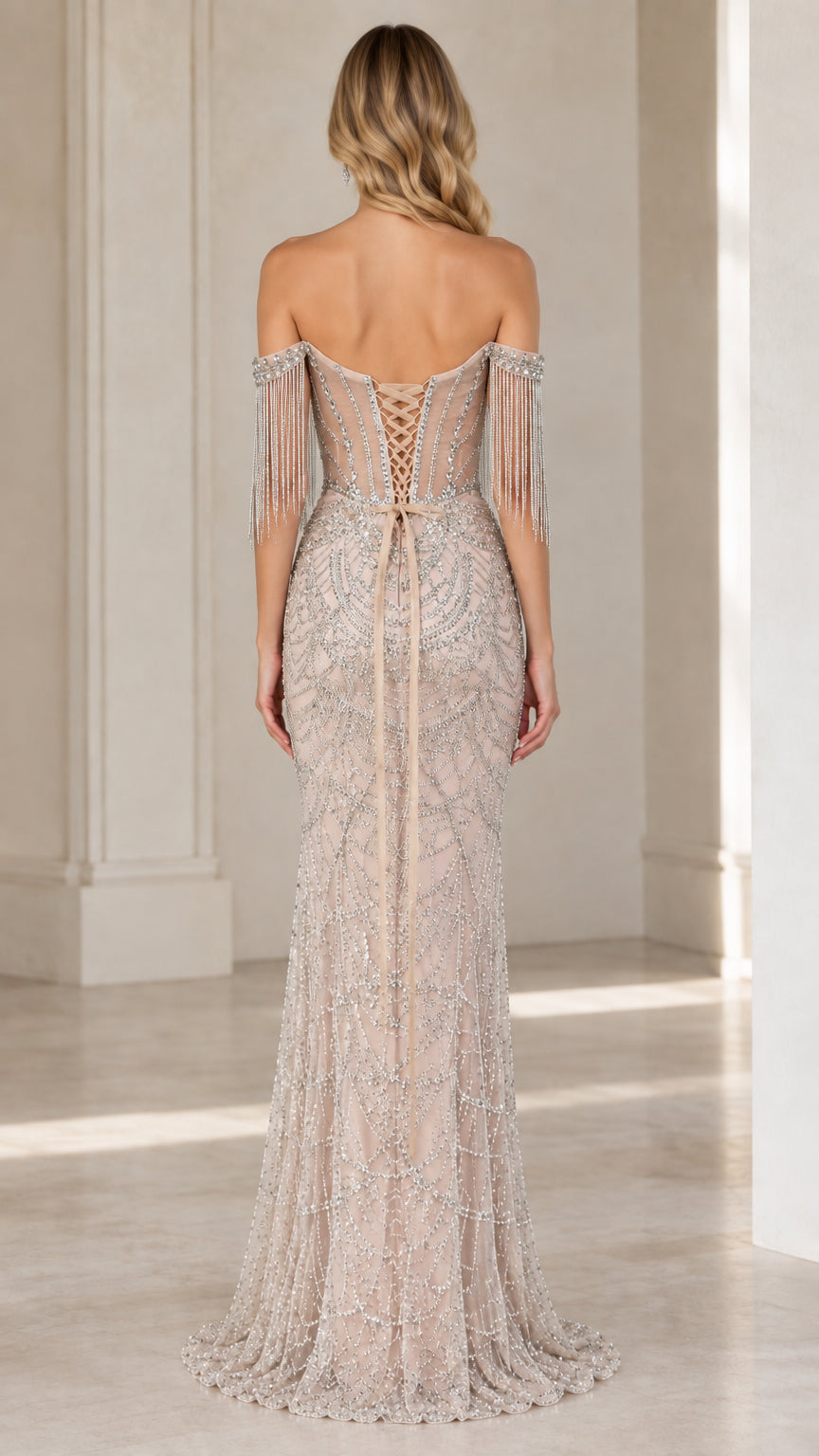 Back view of champagne formal gown showcasing lace-up corset closure