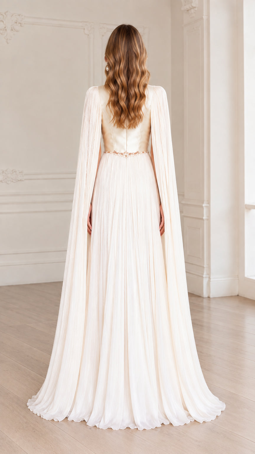 Back view of ivory floor-length gown with flowing pleated cape
