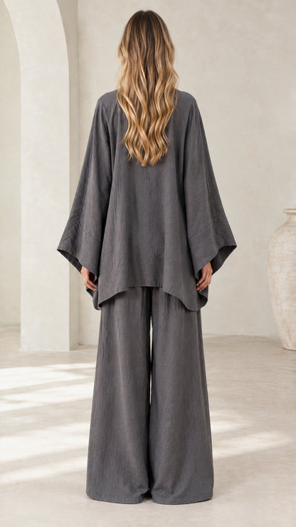 Back view of women's charcoal gray loose fit tunic top and relaxed wide leg trousers