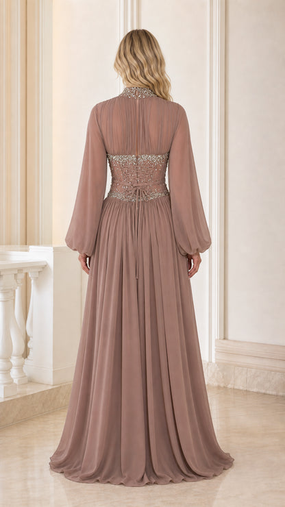 Back view of dusty mauve formal evening gown showing embellished waist detail and floor-length skirt