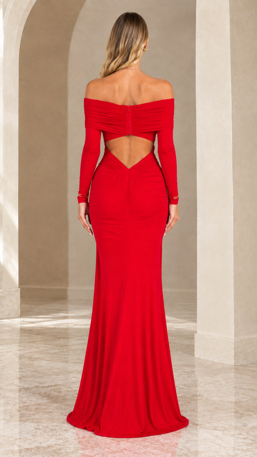 Back view of red floor-length gown showcasing diamond back cutout detail