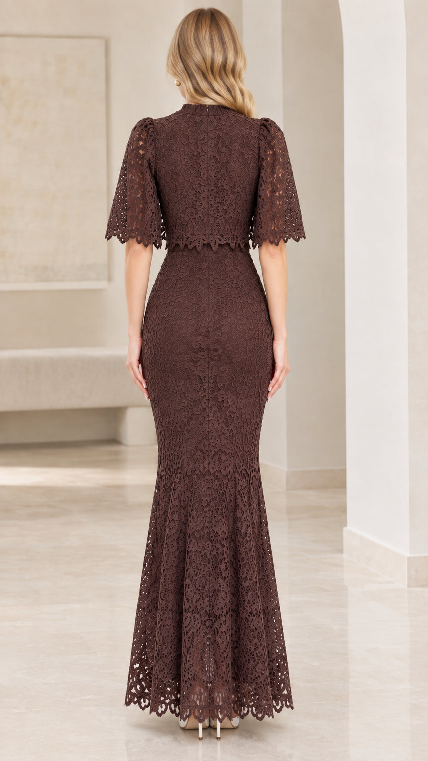 Back view of chocolate brown lace evening dress showing capelet and zipper closure