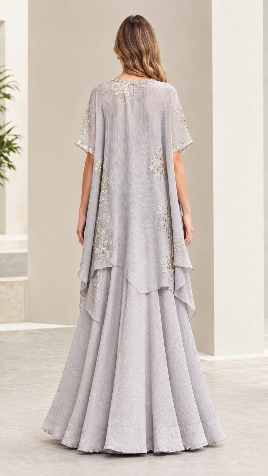 Back view of silver gray sheer embroidered cape and flared pants