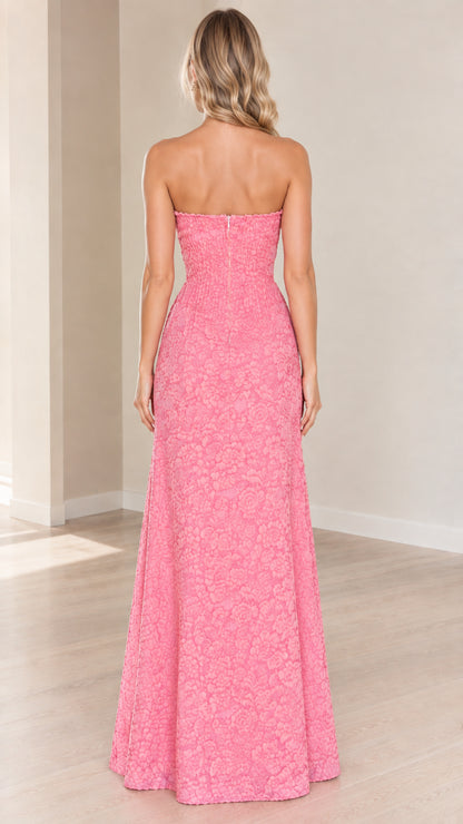 Back view of model wearing pink strapless floral textured maxi dress
