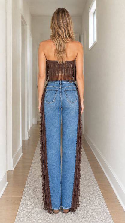 Back view of brown strapless fringe crop top paired with high-rise denim jeans