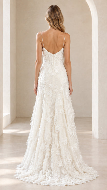 Back view of the ivory tiered lace gown highlighting the low open back and spaghetti straps
