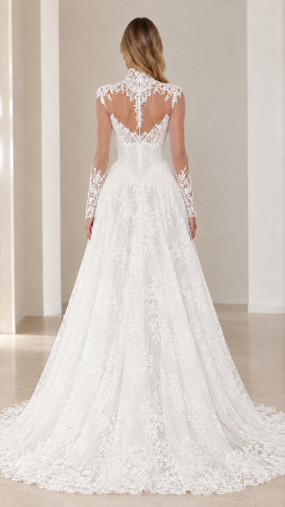Back view of model showcasing the sheer illusion lace back and train of the White gown