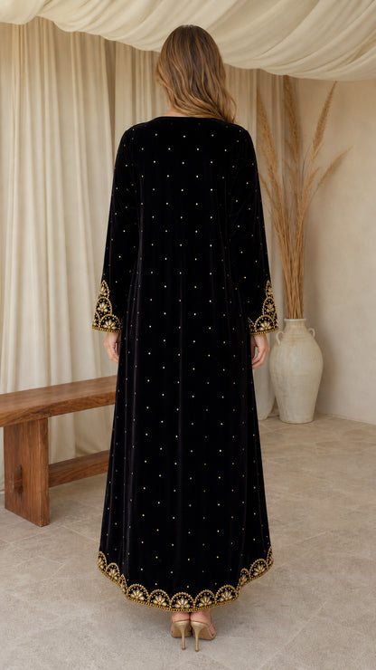 Back view of black velvet maxi dress with scattered sparkle embellishments
