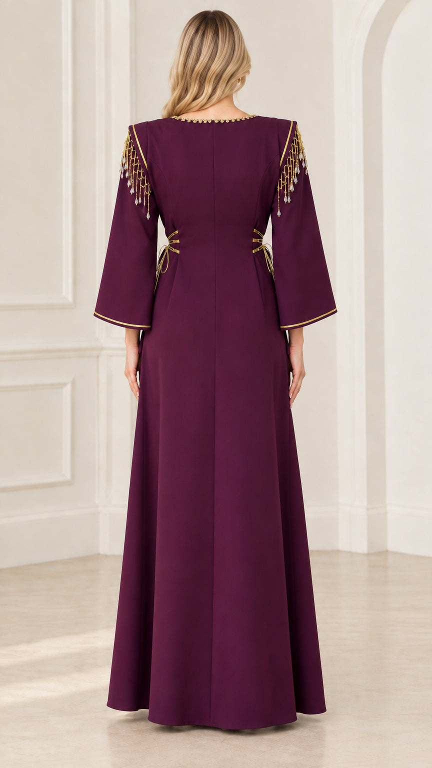 Back view of deep purple maxi dress showing clean tailored lines and shoulder fringe