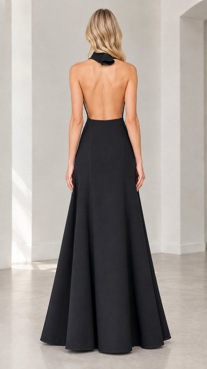 Back view of black halter gown showcasing open back design