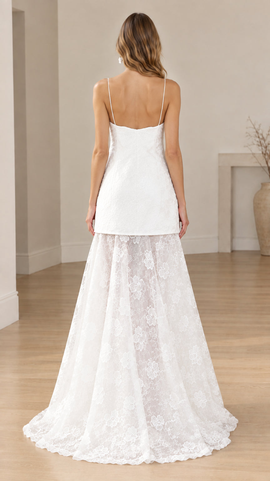 Back view of white spaghetti strap lace formal gown with sweeping train