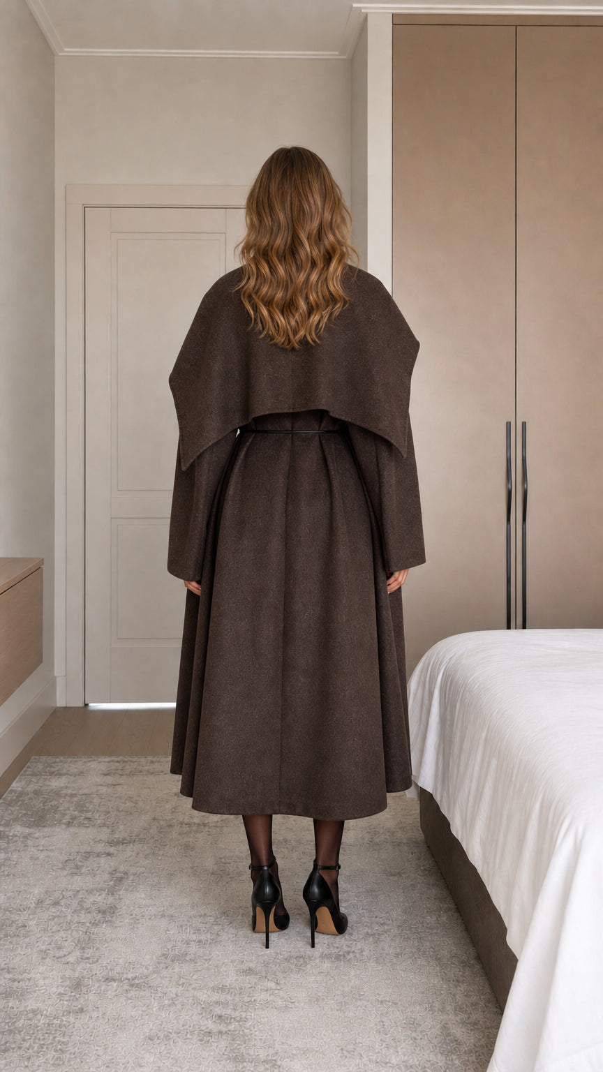 Back view of model wearing chocolate brown cape coat showing rear shawl overlay