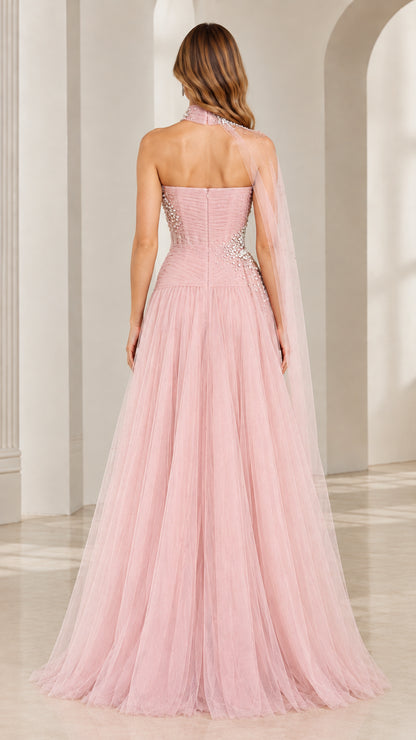 Back view of blush pink evening dress highlighting strapless back and sheer shoulder drape