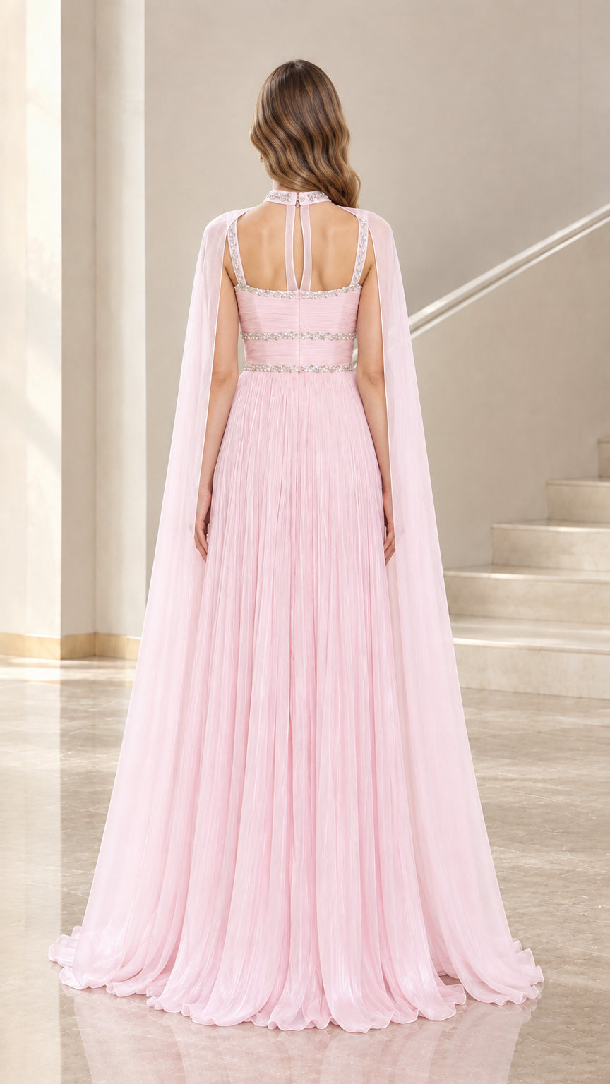 Back view of Light Pink evening gown showcasing cut-out straps and sweeping cape