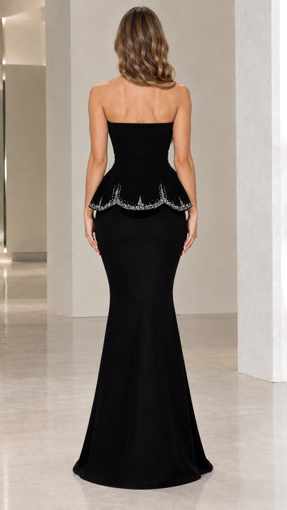 Back view of black strapless floor-length mermaid formal gown