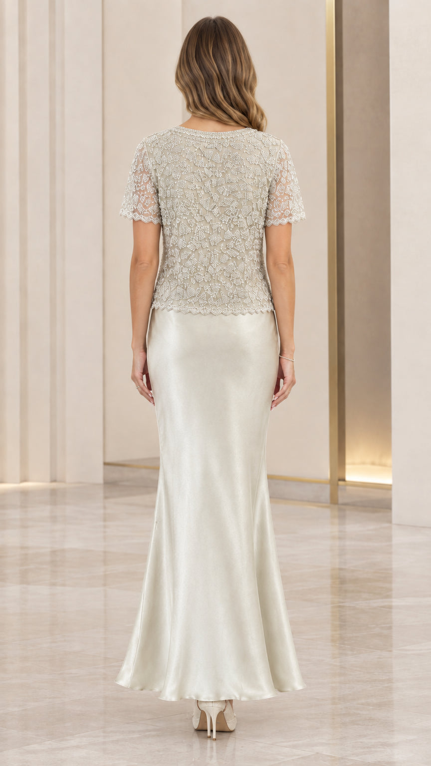 Back view of elegant silver beaded top and floor-length satin formal gown
