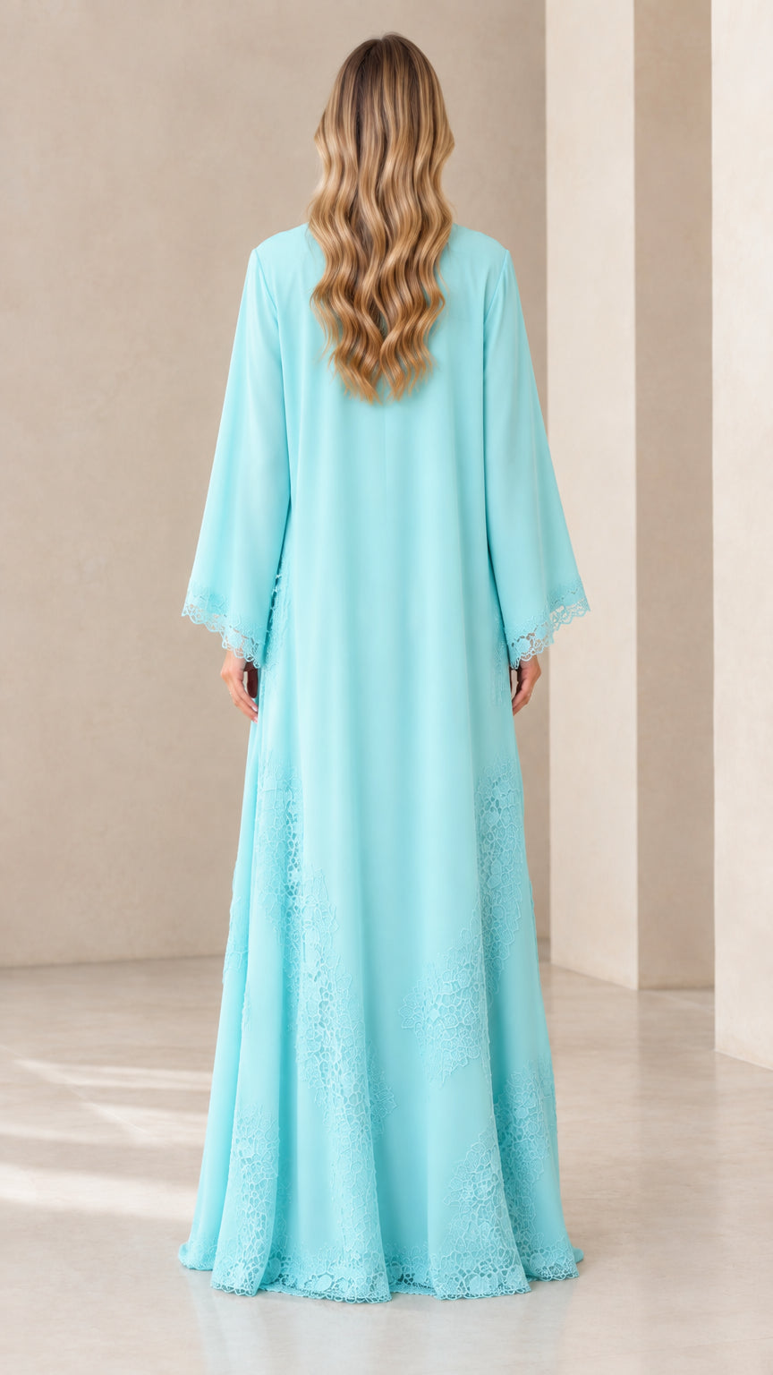 Back view of model wearing full-length aqua blue chiffon duster