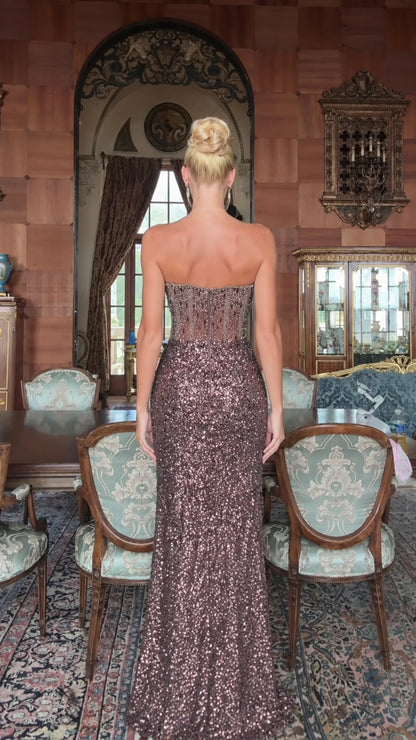 Back view of model in mocha brown strapless corset sequin gown with sheer boned back