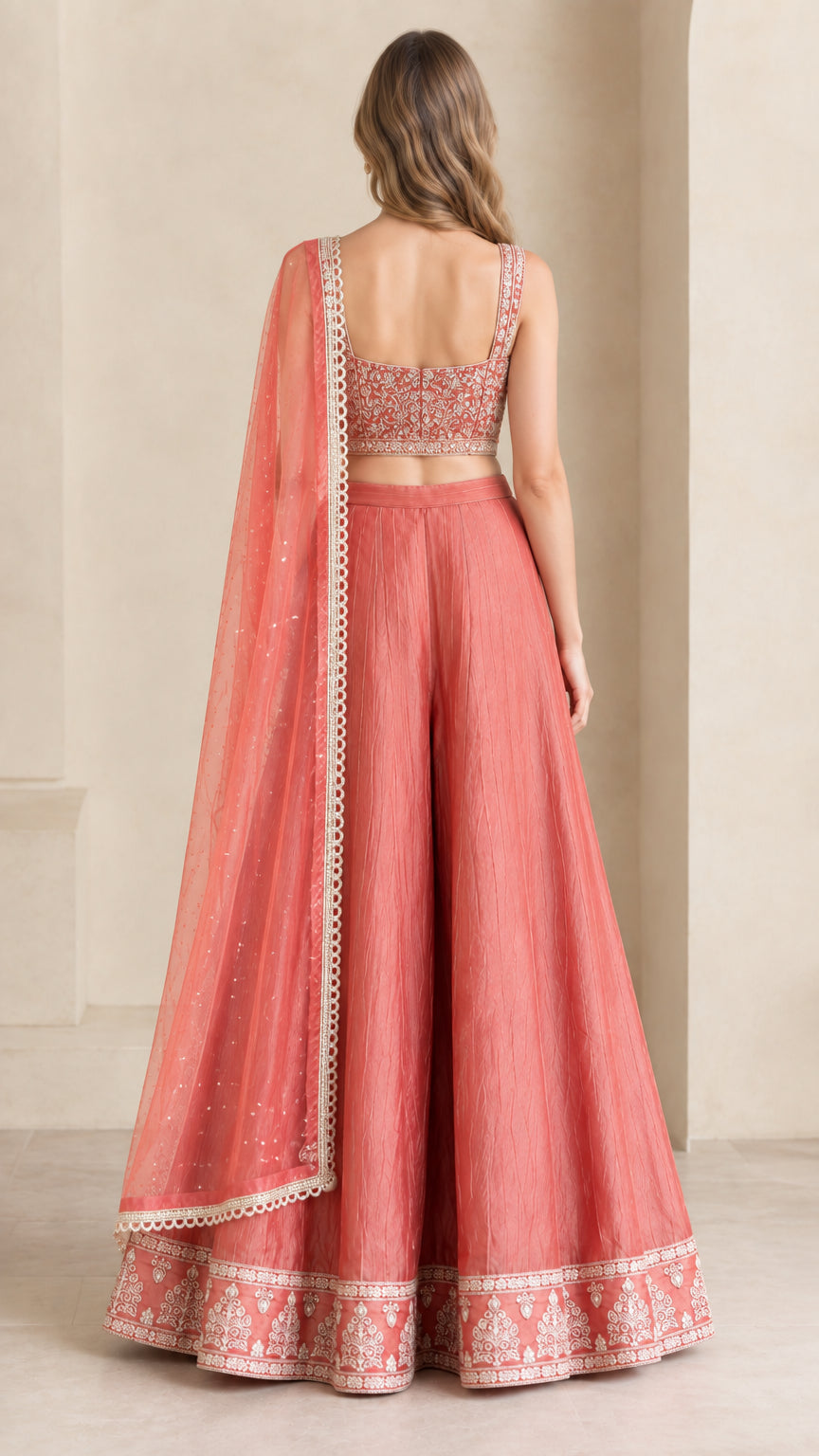 Back view of coral pink crop top and flowing wide-leg pants set with dupatta