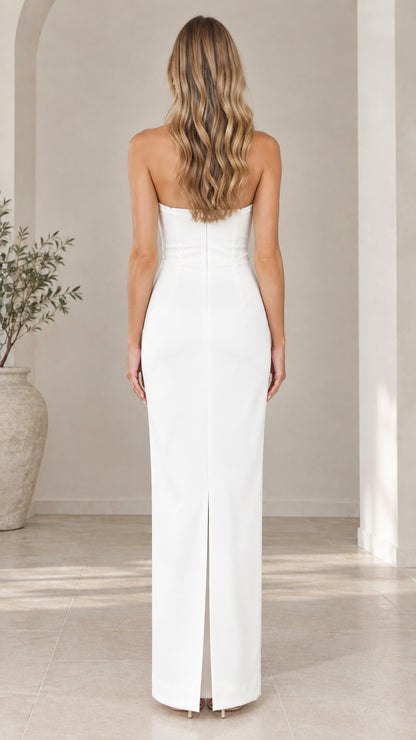 Back view of white strapless column dress showing back slit