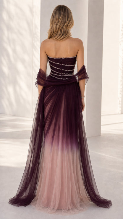 Back view of the burgundy ombre tulle gown showcasing the strapless back and flowing sheer shawl