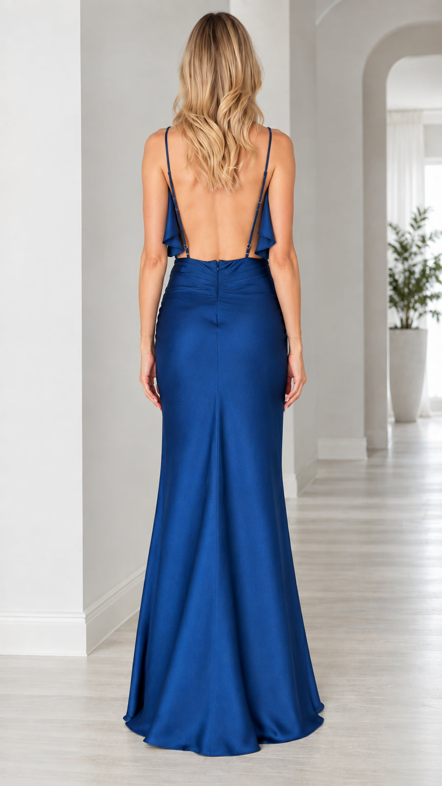 Back view of royal blue satin evening gown showing low back and thin straps