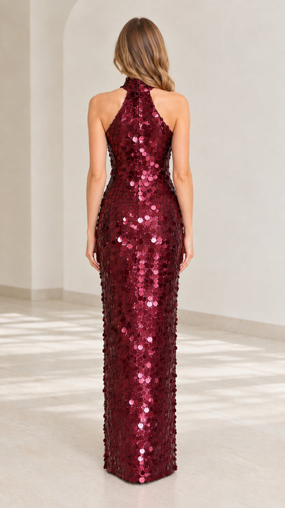 Back view of model wearing burgundy sequin halter maxi dress