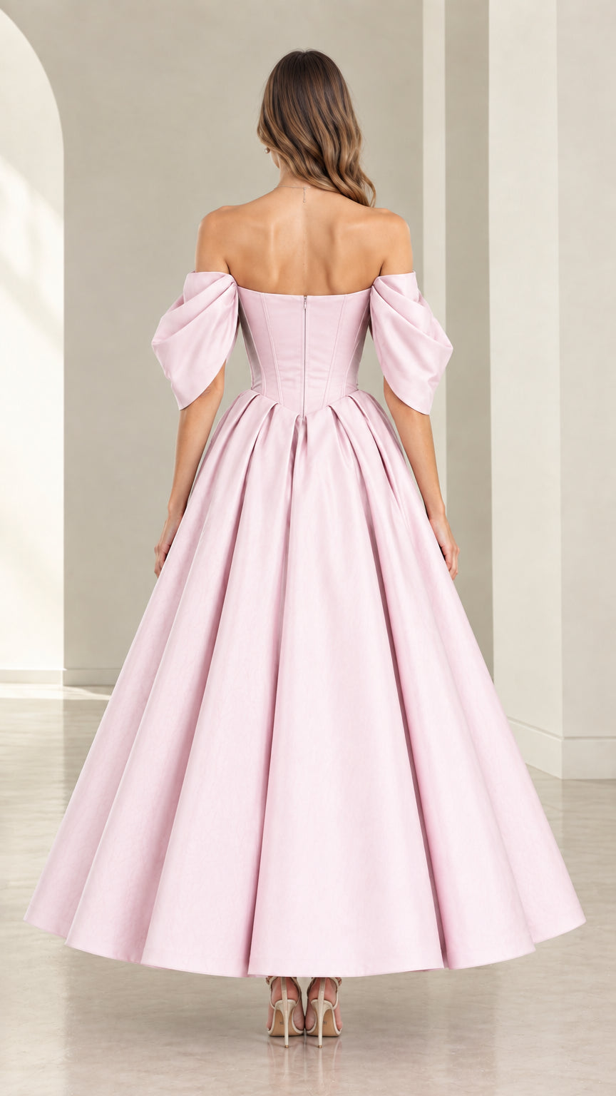 Back view of model showcasing Blush Pink corset back and pleated skirt