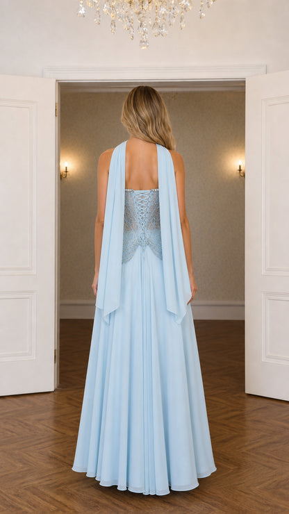 Back view of sky blue corset formal gown showing lace-up back and draping scarf