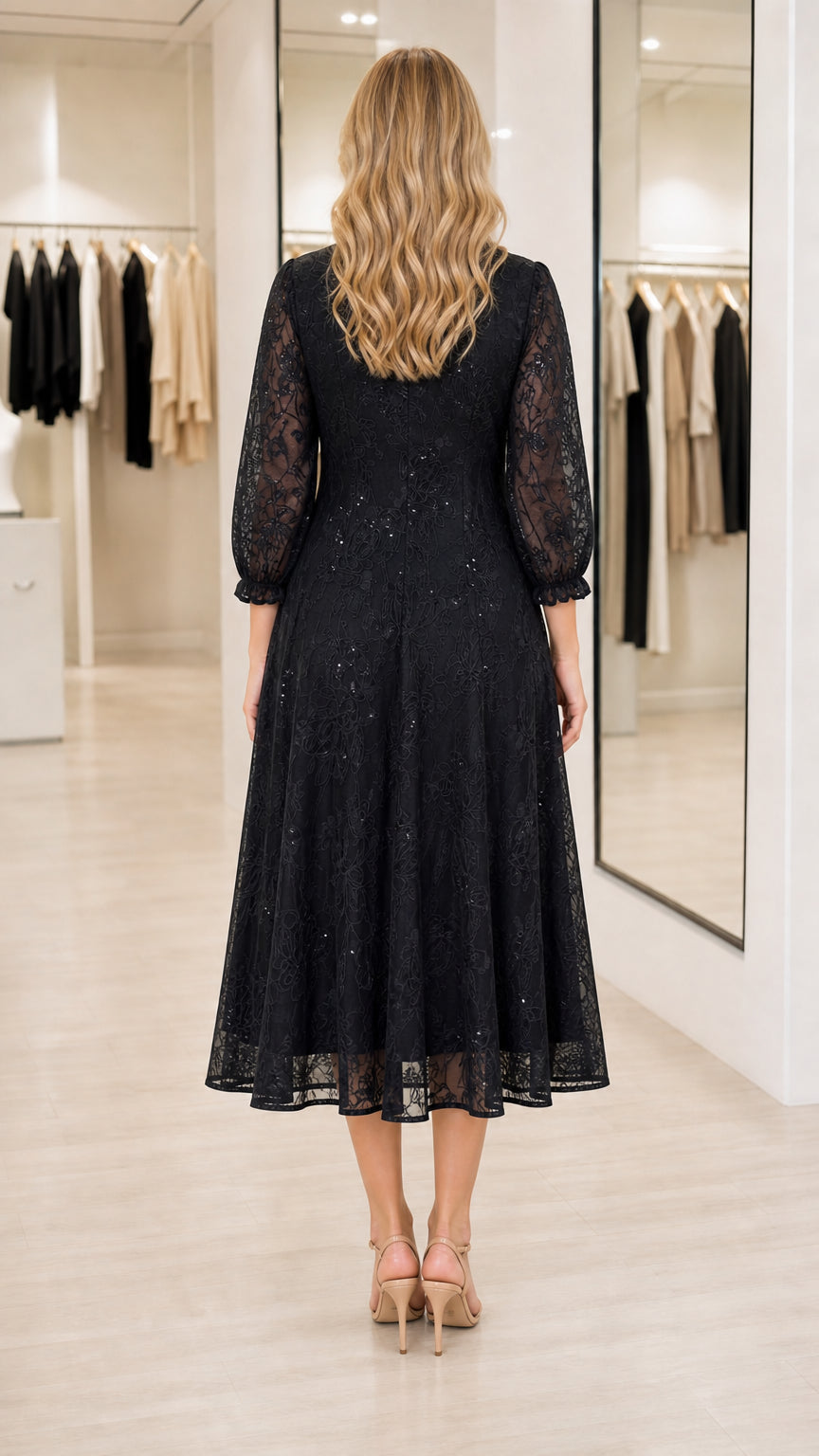 Back view of model wearing black lace A-line midi dress