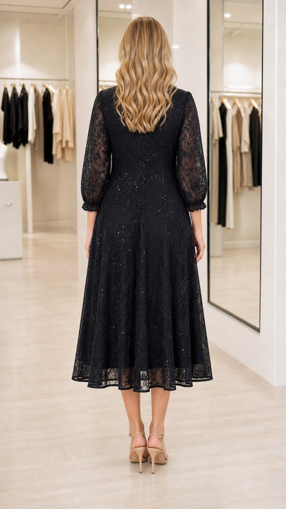 Back view of model wearing black lace A-line midi dress