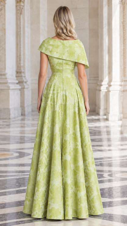 Back view of Lime Green floral jacquard formal gown with elegant drape