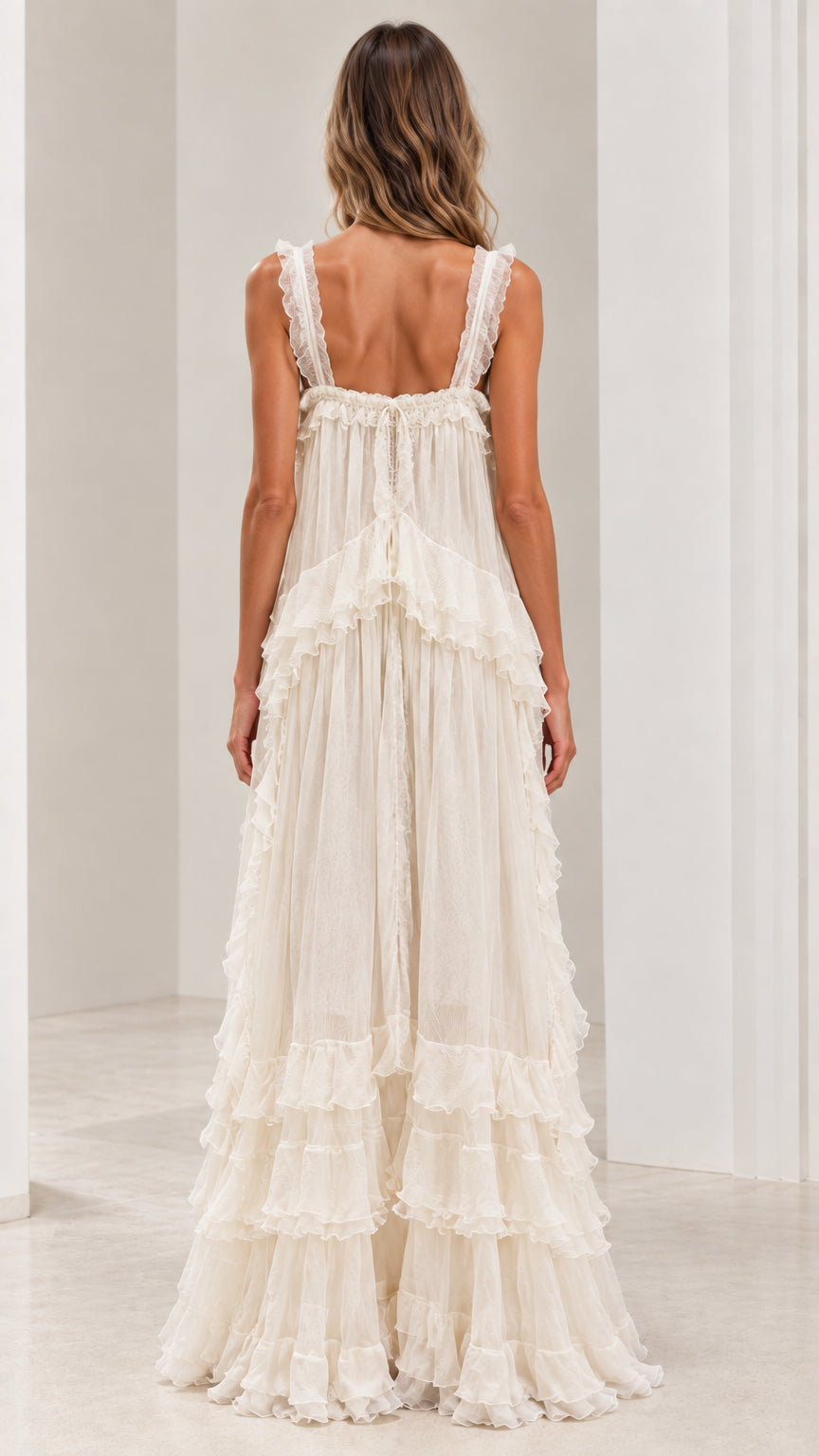 Back view of ivory ruffled strap maxi dress showcasing low back design