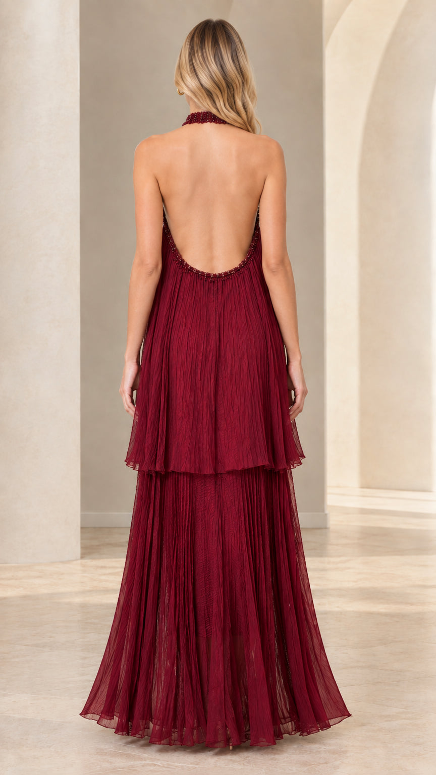 Back view of burgundy halter maxi dress showing open back design