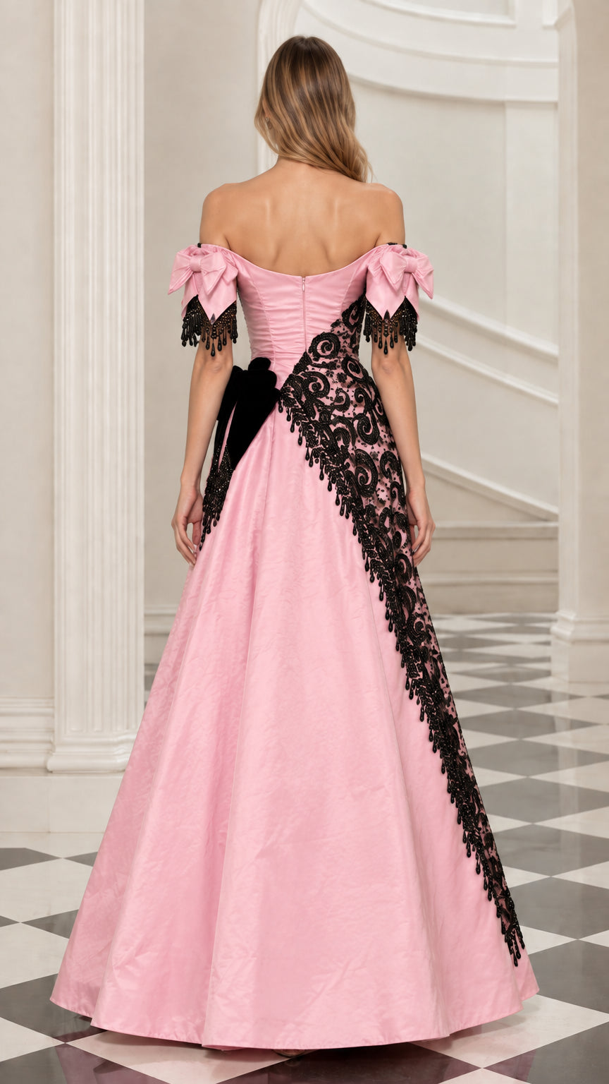 Back view of model in pink off-the-shoulder ball gown with bow sleeves