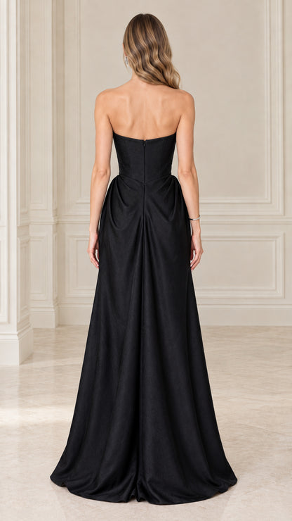 Model wearing black strapless satin corset maxi gown back view